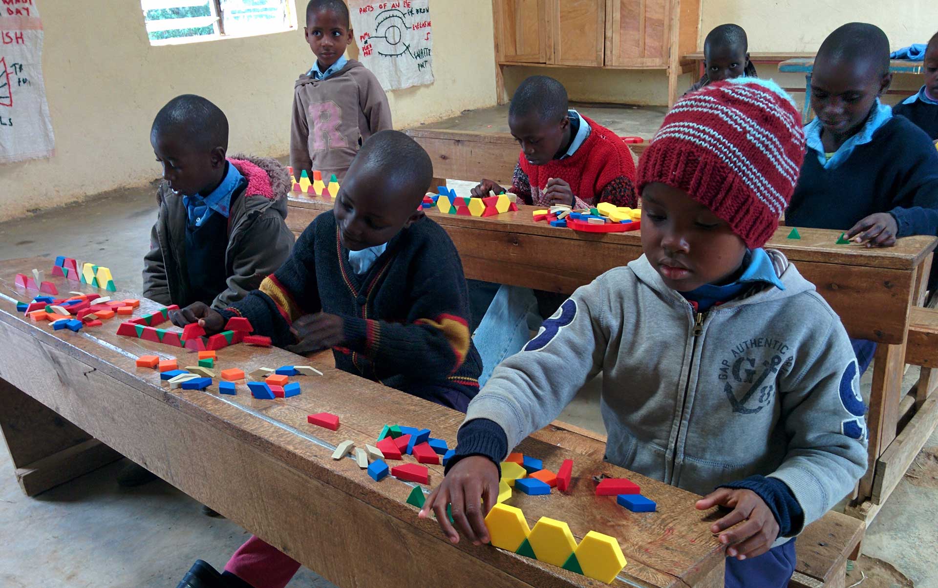 OLOG Students in a classroom using learning aids