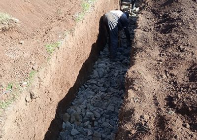 The groundwork begins with a hand-dug trench.